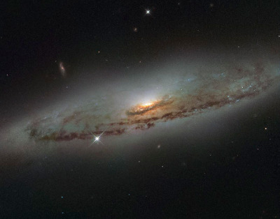 A spiral galaxy, located over 65 million light-years away